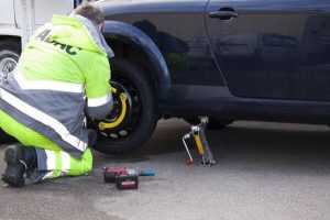 Mechanic working on a Flat tyre