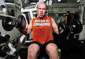 Man liftig weights on Gym