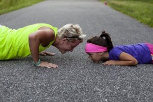 Woman working out with a child